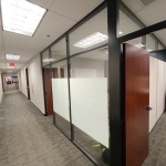 Flex series black framed glass office fronts with solid sidewall and glass clerestory #1671