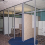 Glass offices with whiteboards solid panel demising walls