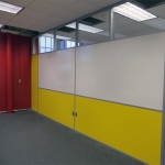 Classroom dividing wall partition with built-in whiteboard and clerestory