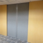 Double wood sliding doors with pleats grid silverado finish wall panels