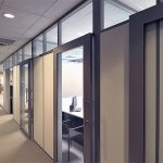 Enclosed offices with sliding aluminum framed glass doors #0585