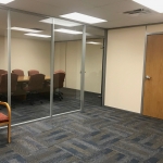 Glass conference room with swing doors - financial institution installation #1171