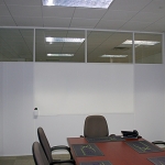 Conference room with white extrusions and integrated whiteboard