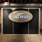 Industrial Black Laminate Feature Wall with Stainless Steel LED Logo