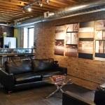 NxtWall lounge area and bar with timeline art gallery display #0255