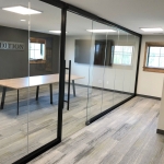 All glass conference room with black wall frame finish #1650
