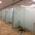 Glass offices with locking sliding frameless glass doors