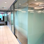 Glass offices with decorative window film and open corner #0937