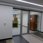 Glass office fronts - butt jointed glass solution with aluminum framed door #0283
