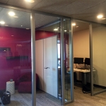 Glass offices with seamless glass return wall (wingback) and butt-joint clerestory #0934