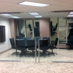 Glass conference room with double swing glass hinged doors